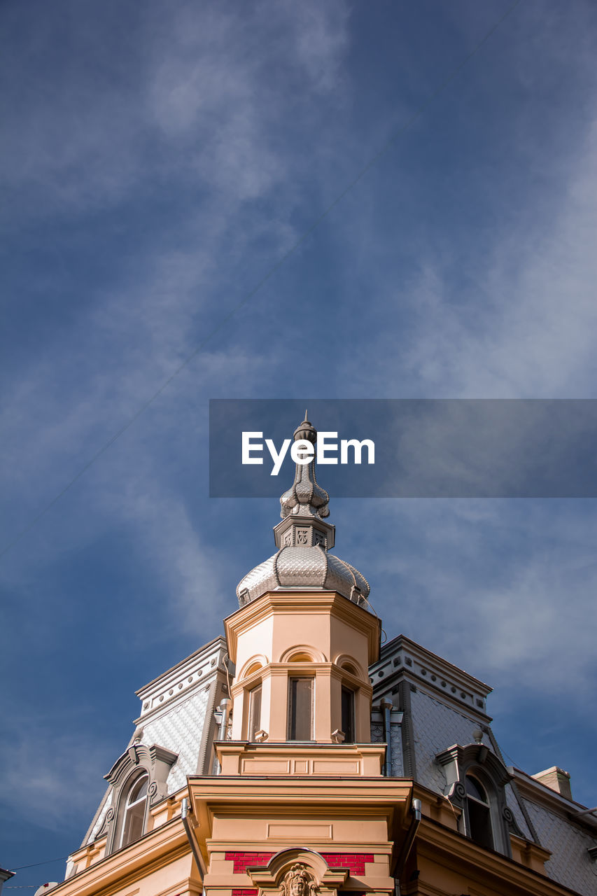 Low angle view of building against blue sky