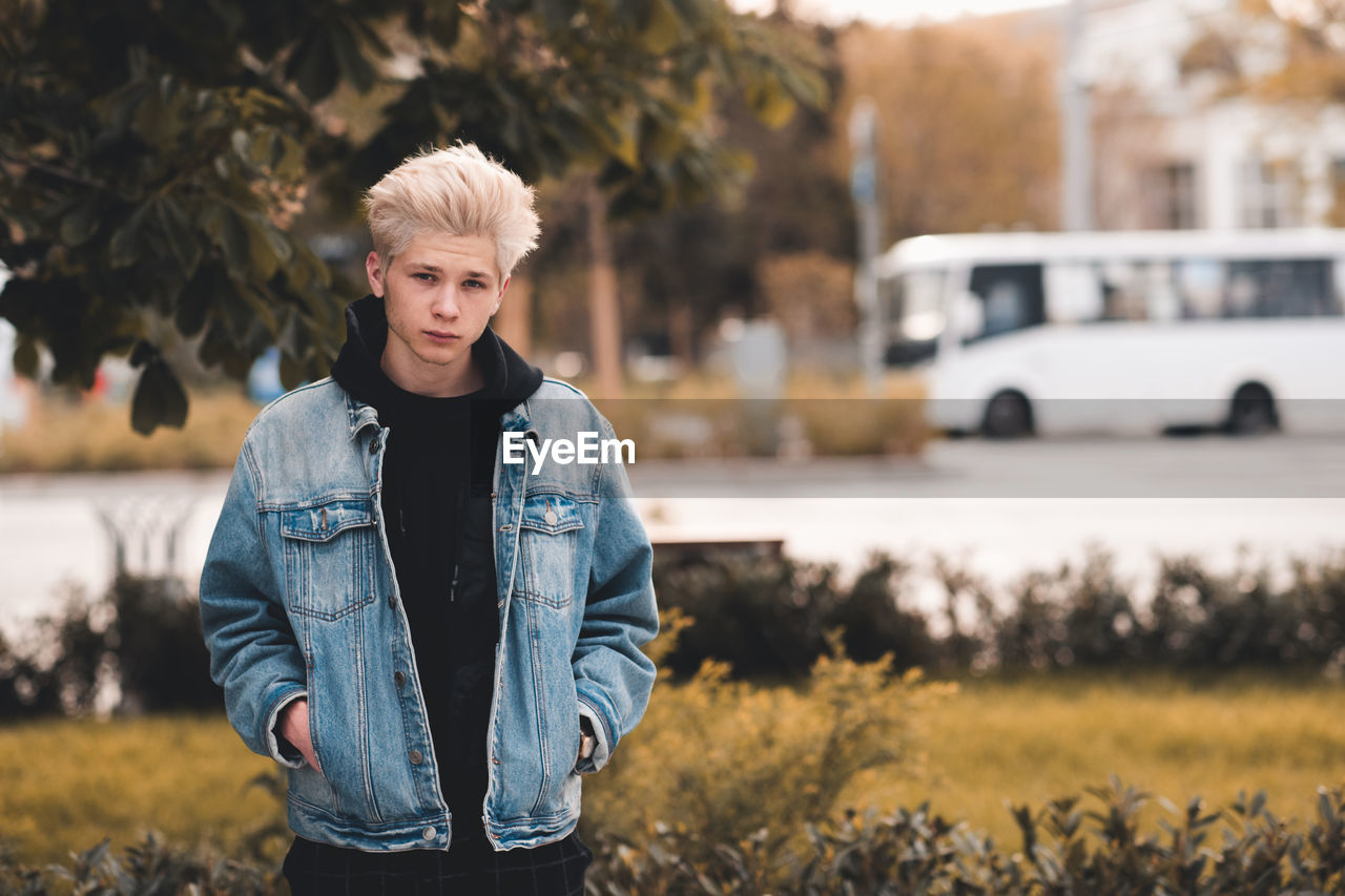 Portrait of young man standing outdoors