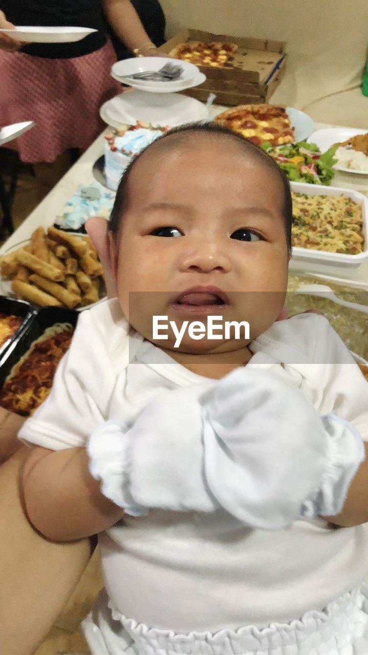 baby, child, childhood, cute, person, one person, portrait, indoors, innocence, high angle view, babyhood, front view, toddler, looking at camera, clothing, beginnings, baby clothing, lying down, furniture, skin, emotion, lying on back, lifestyles, adult, relaxation, sitting