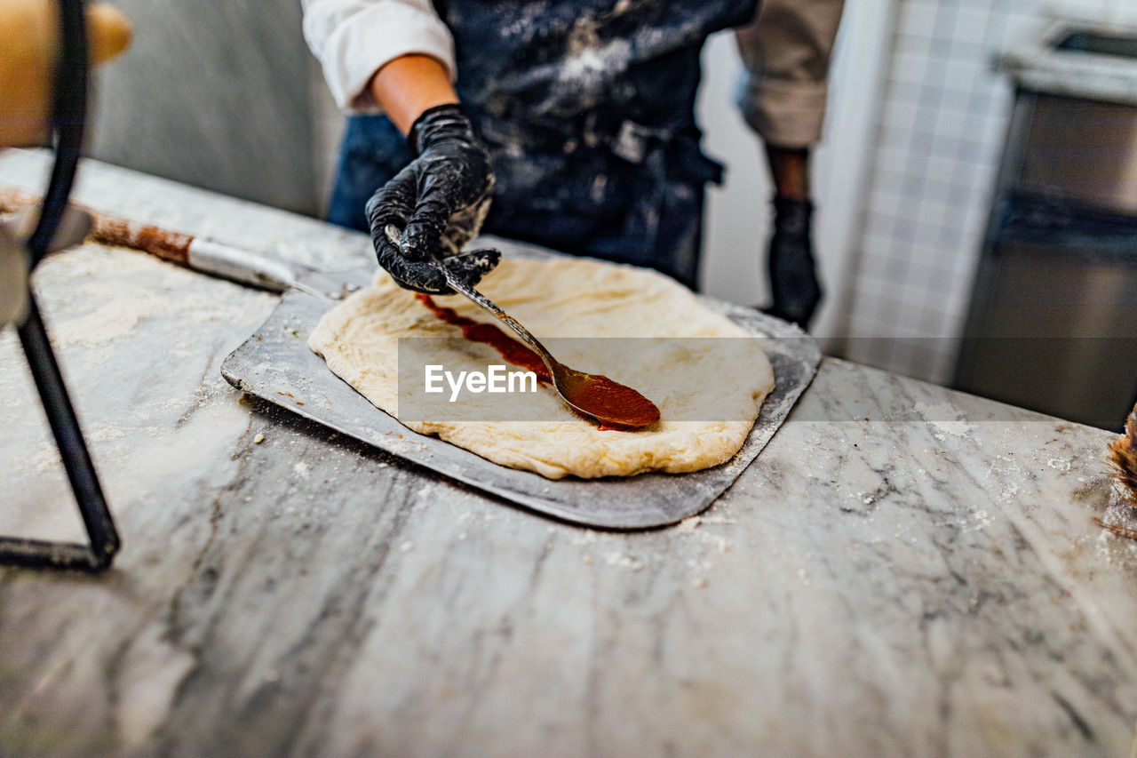 Baking and serving pitta brad, pizza and fresh bread in dinner restaurant and social events.
