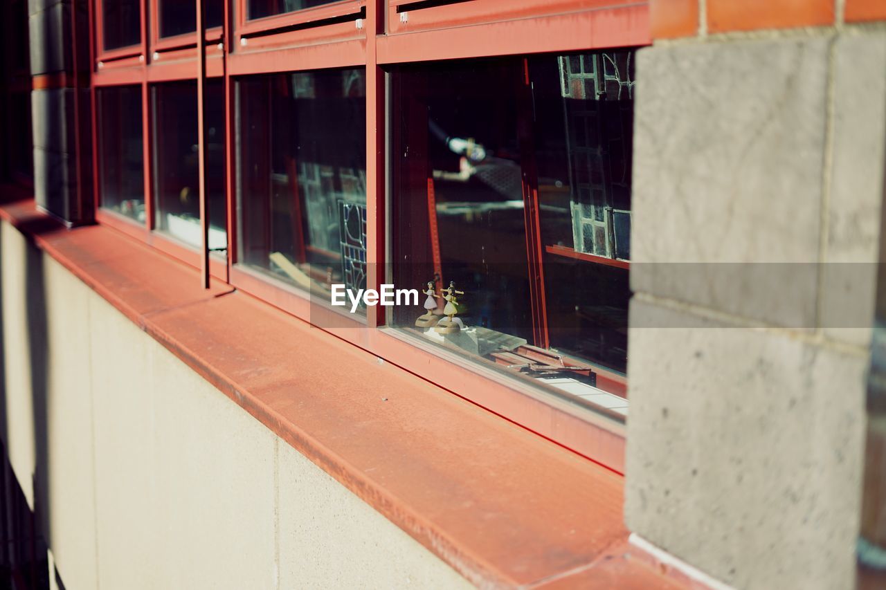 Reflection of building on glass window