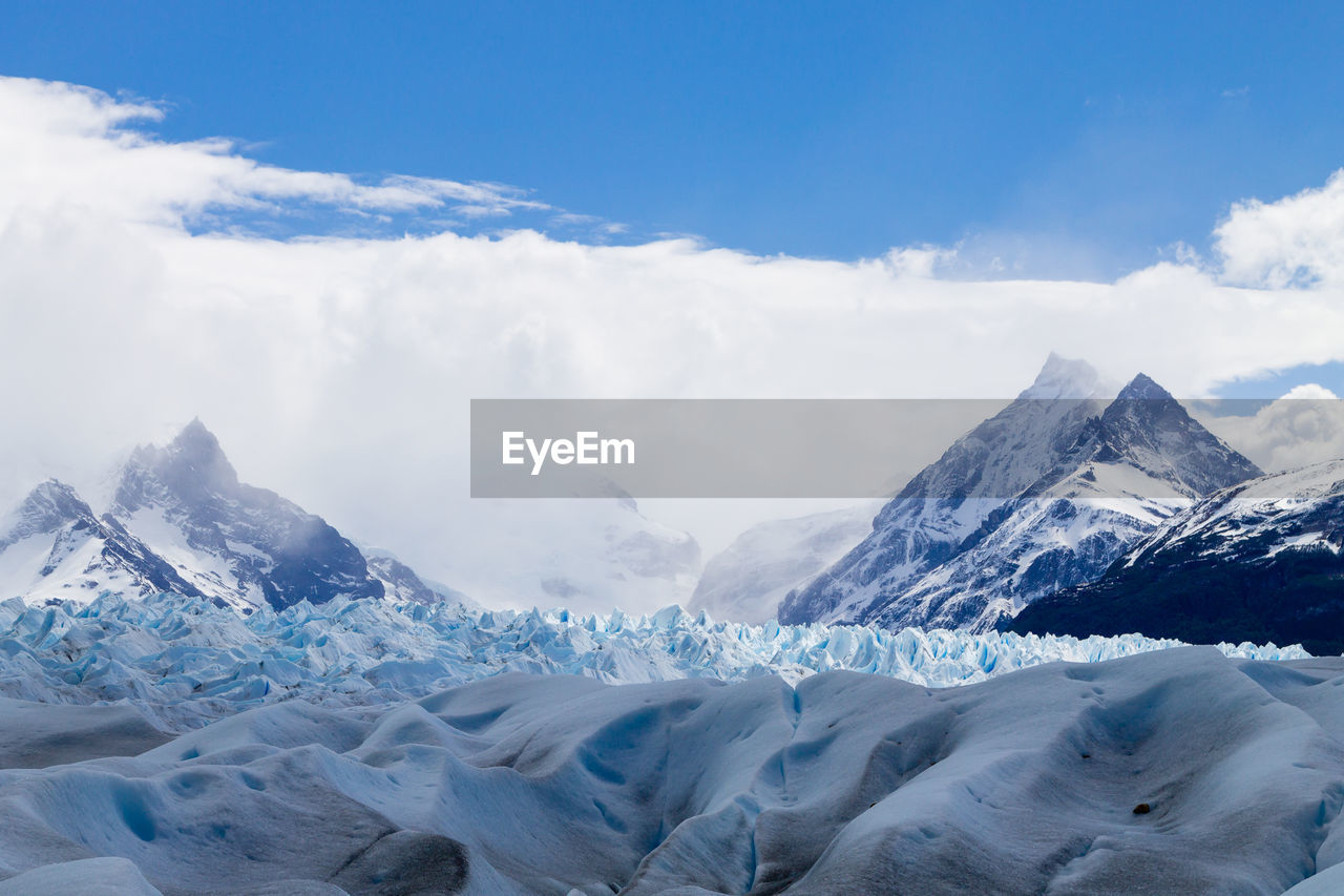 VIEW OF SNOWCAPPED MOUNTAINS AGAINST SKY