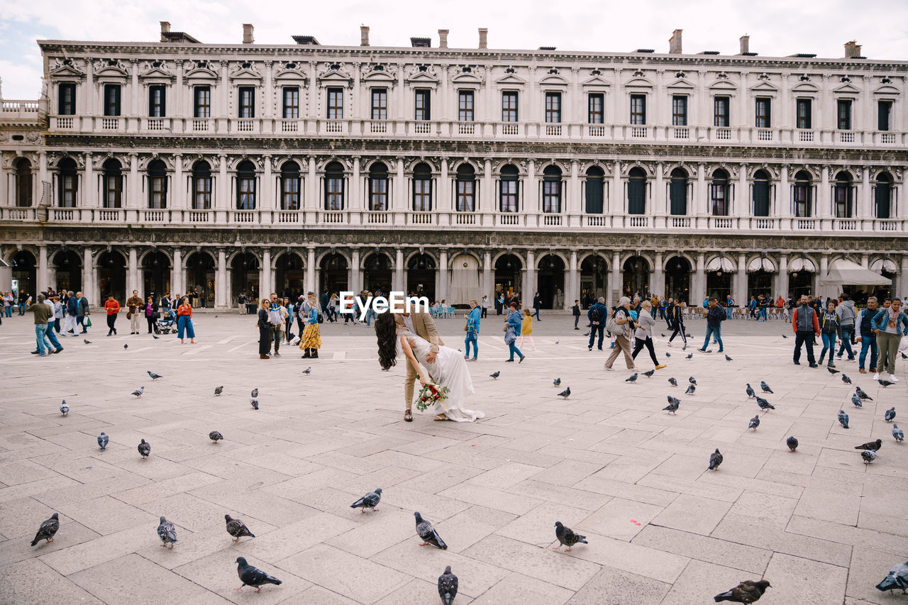 Group of people in front of historical building