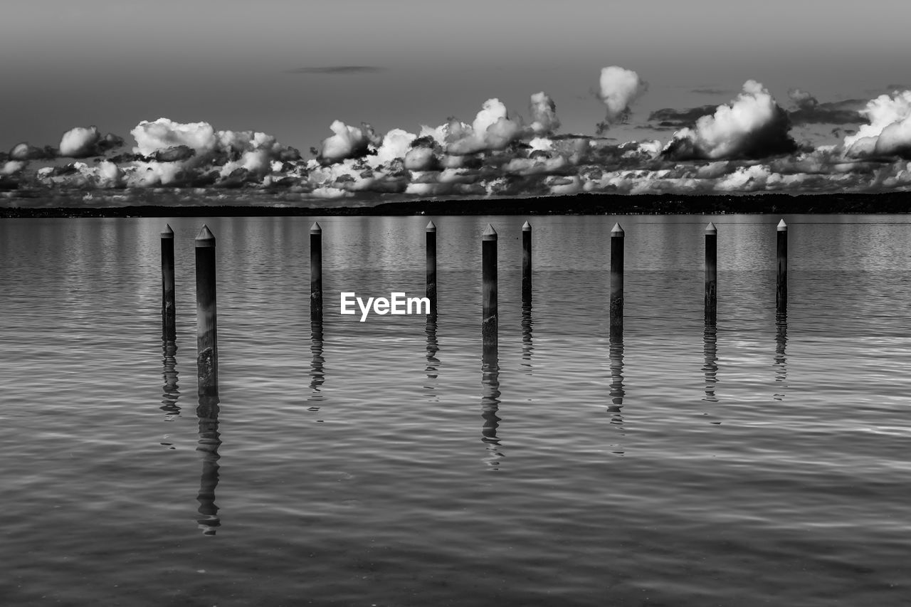 WOODEN POSTS IN SEA