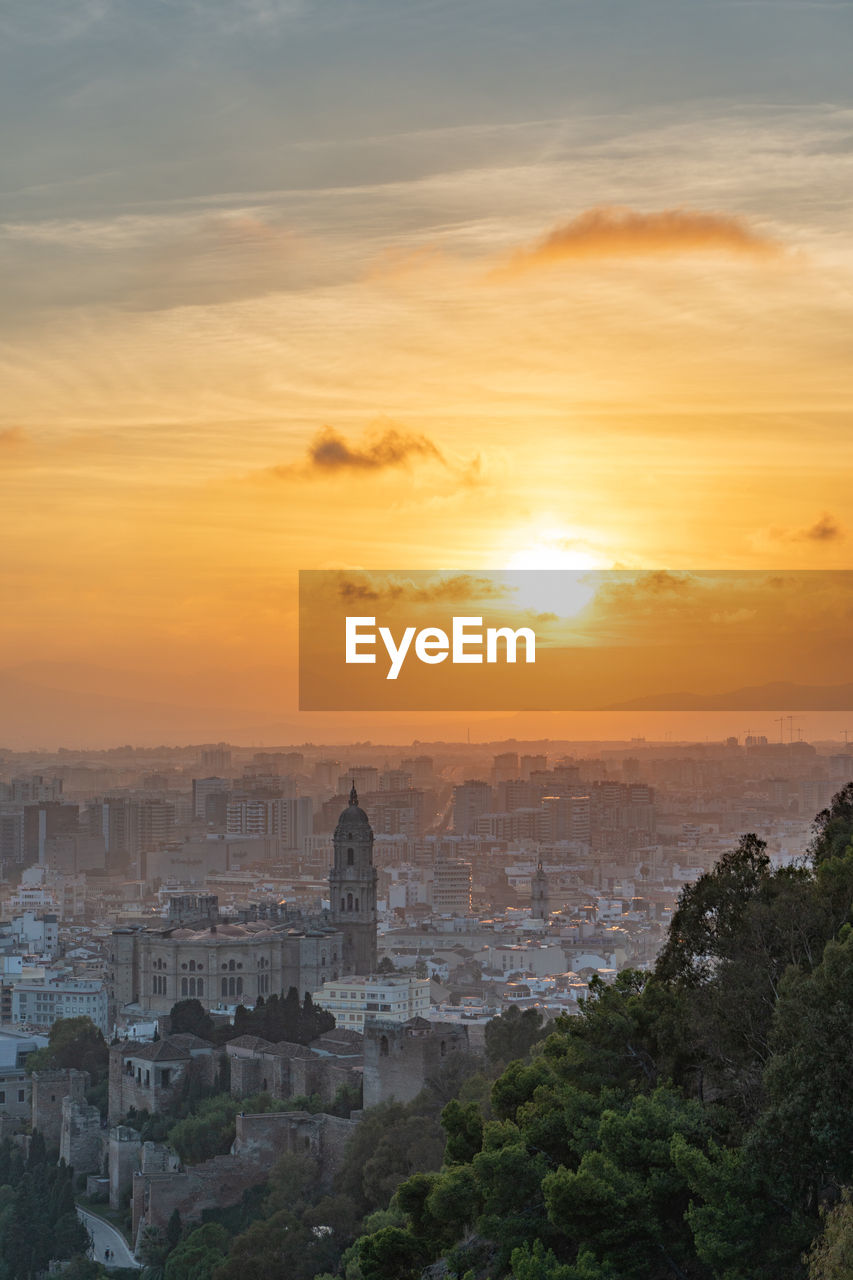 Aerial view of cityscape during sunset