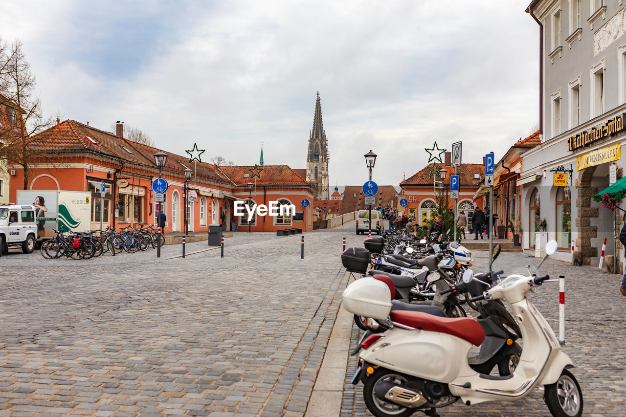 STREET AMIDST BUILDINGS IN CITY