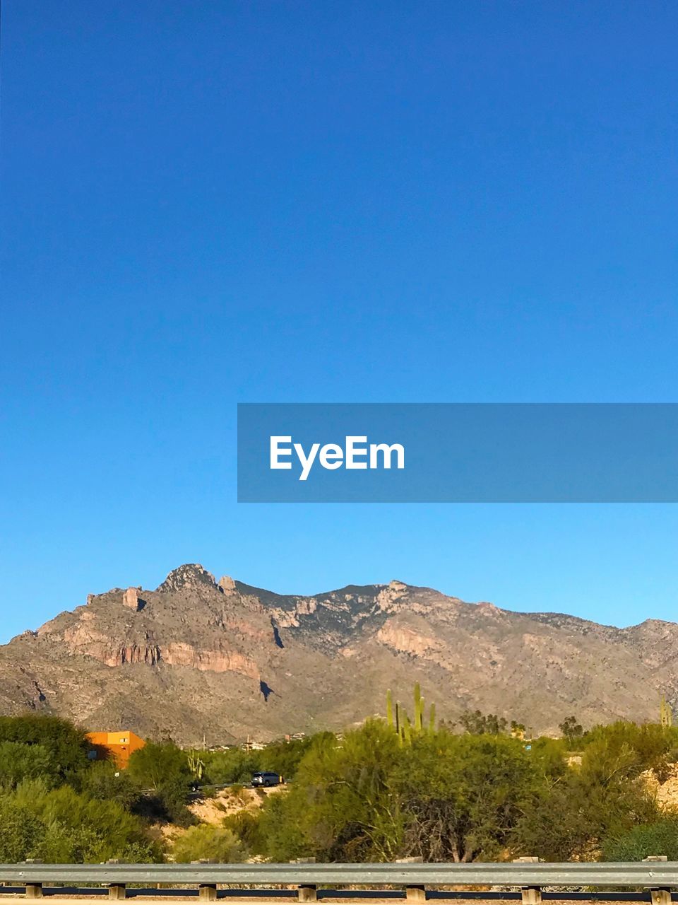 Scenic view of mountains against clear blue sky