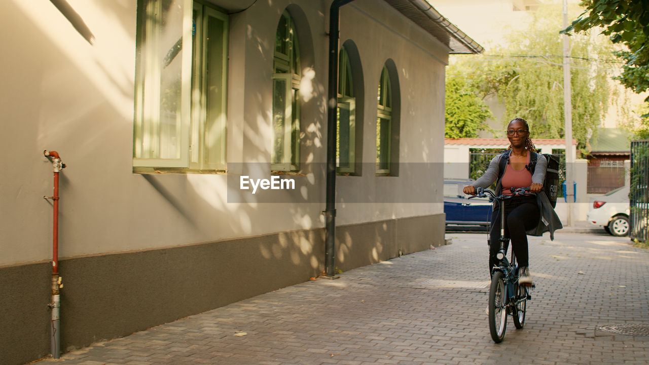 side view of man riding bicycle