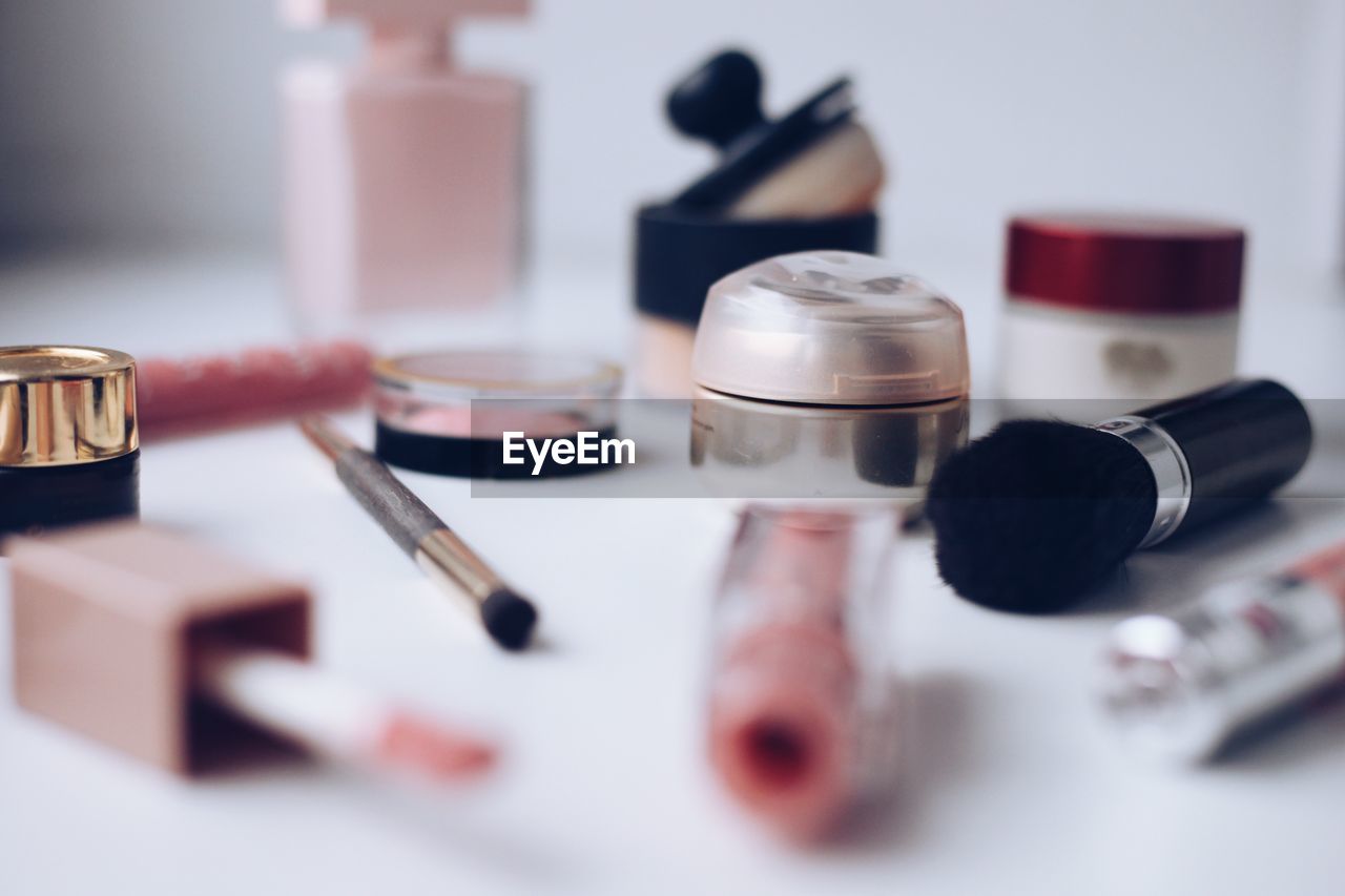 cosmetics, human eye, make-up, hand, beauty product, indoors, lipstick, lip, make-up brush, pink, skin, selective focus, close-up, still life, table, red, healthcare and medicine, studio shot, group of objects, eye shadow, nail