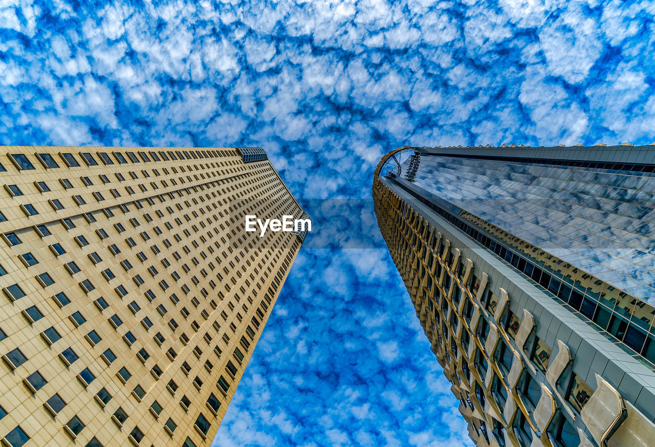 Low angle view of modern buildings against sky