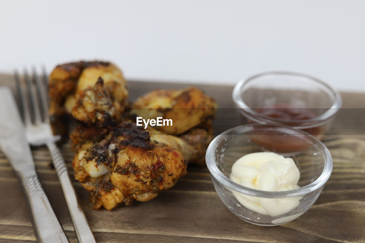 food and drink, food, dish, breakfast, freshness, dessert, produce, healthy eating, meal, baked, indoors, studio shot, no people, wellbeing, eating utensil, kitchen utensil, wood, fried food, household equipment, close-up, focus on foreground, table, cuisine, vegetable, meat