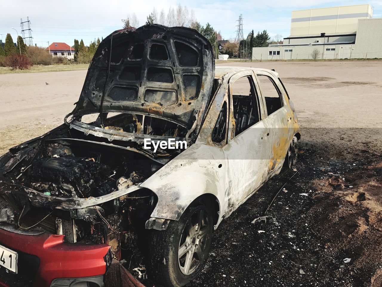 Abandoned car on field