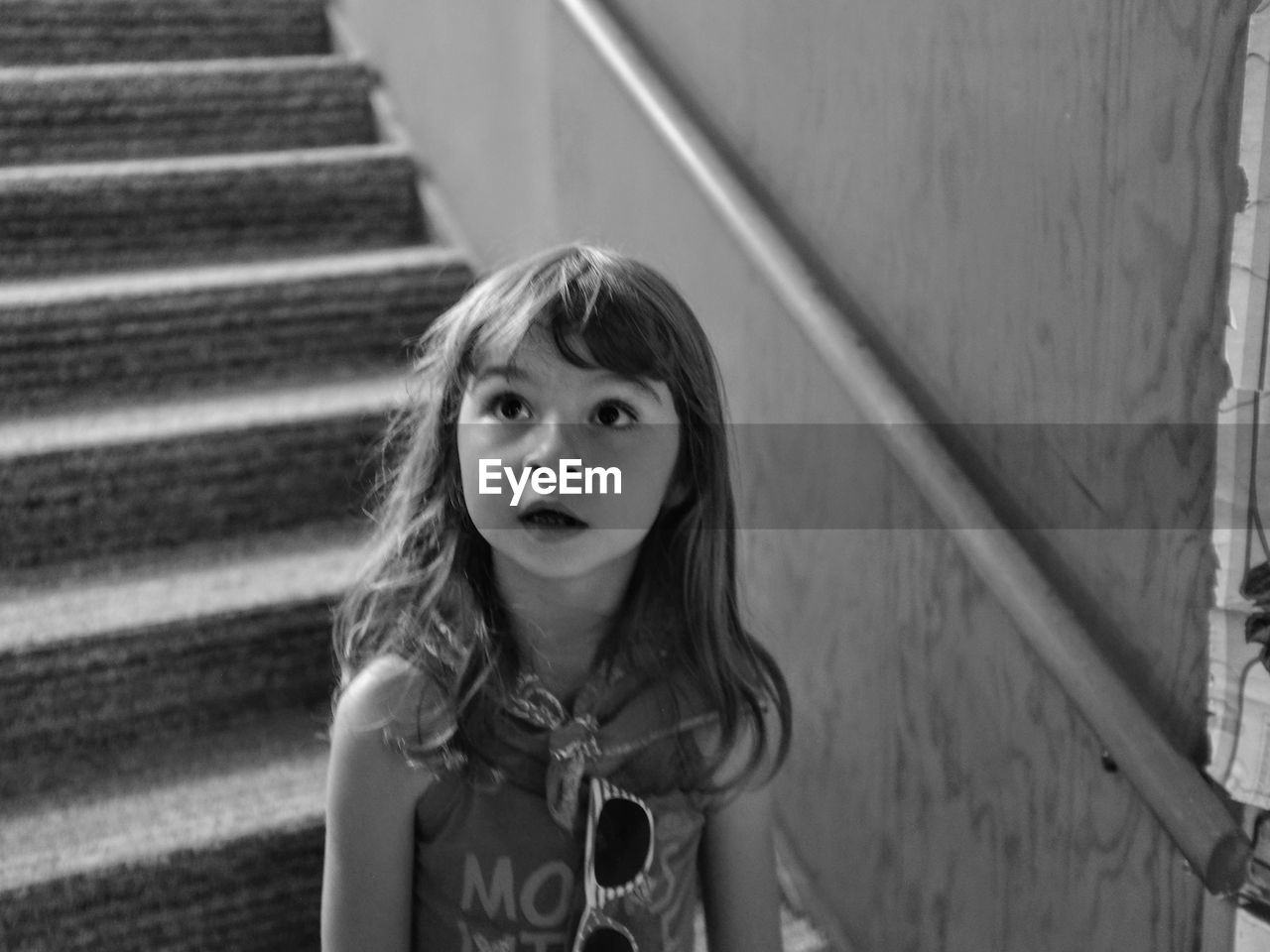 PORTRAIT OF CUTE GIRL WITH STAIRCASE