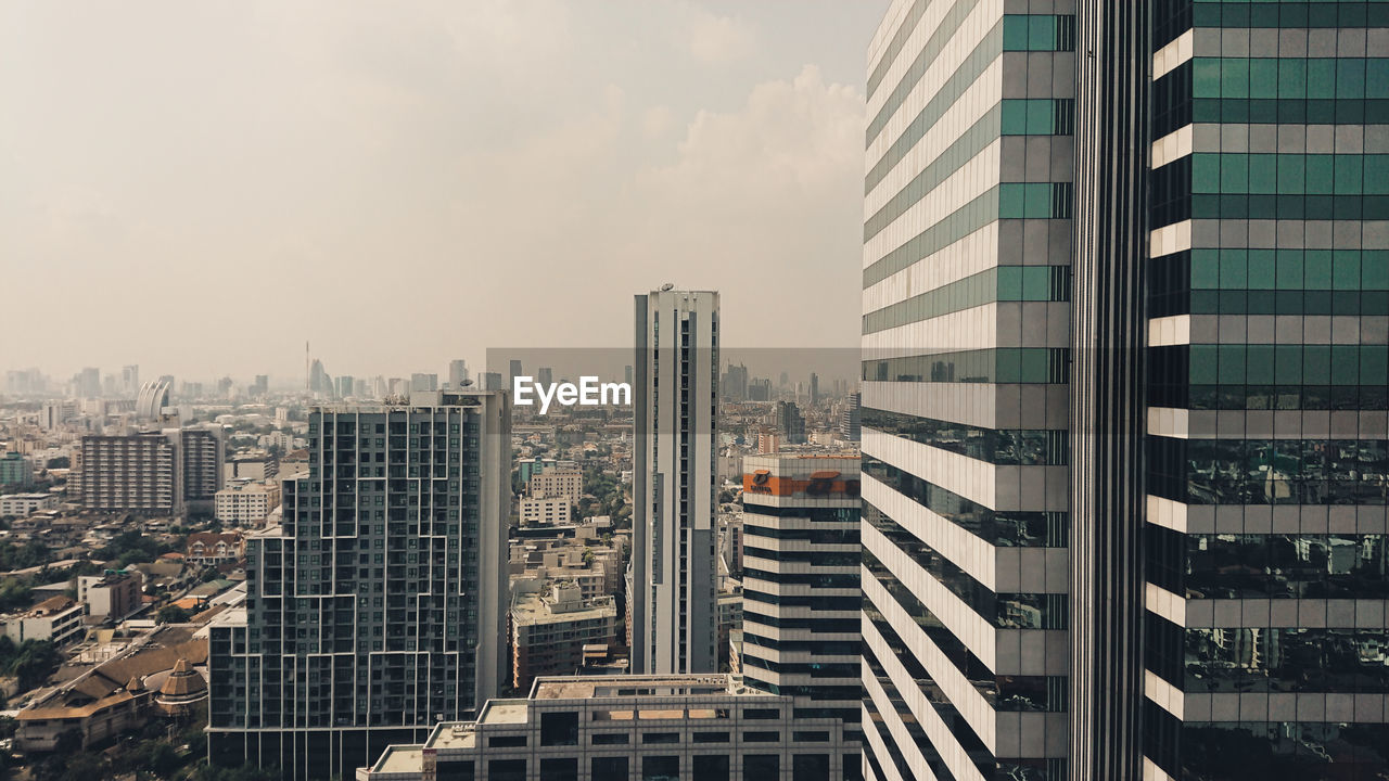 Modern buildings in city against sky