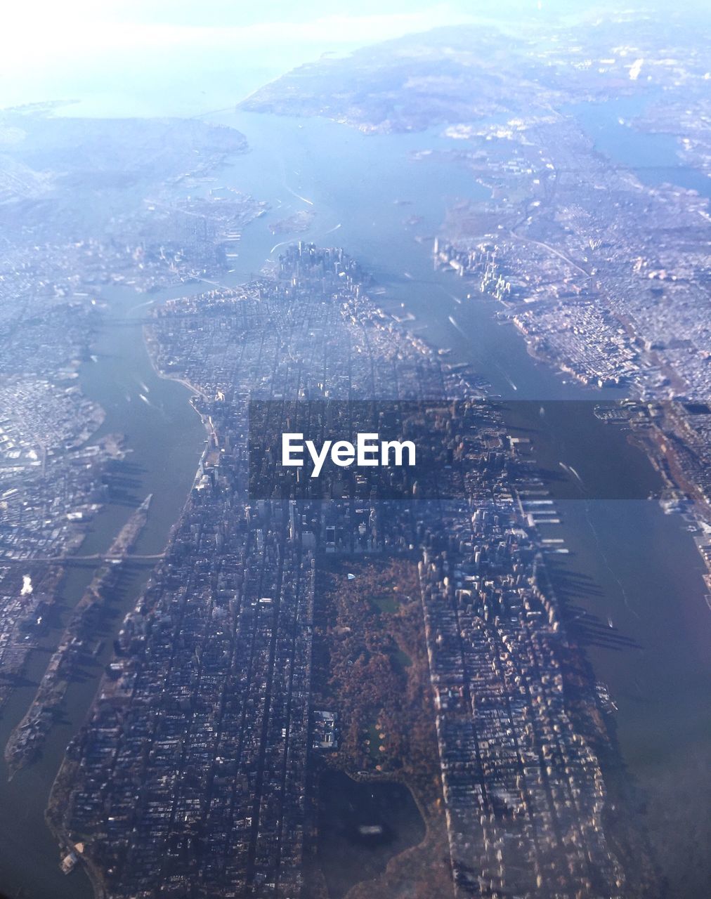 Aerial view of cityscape amidst river