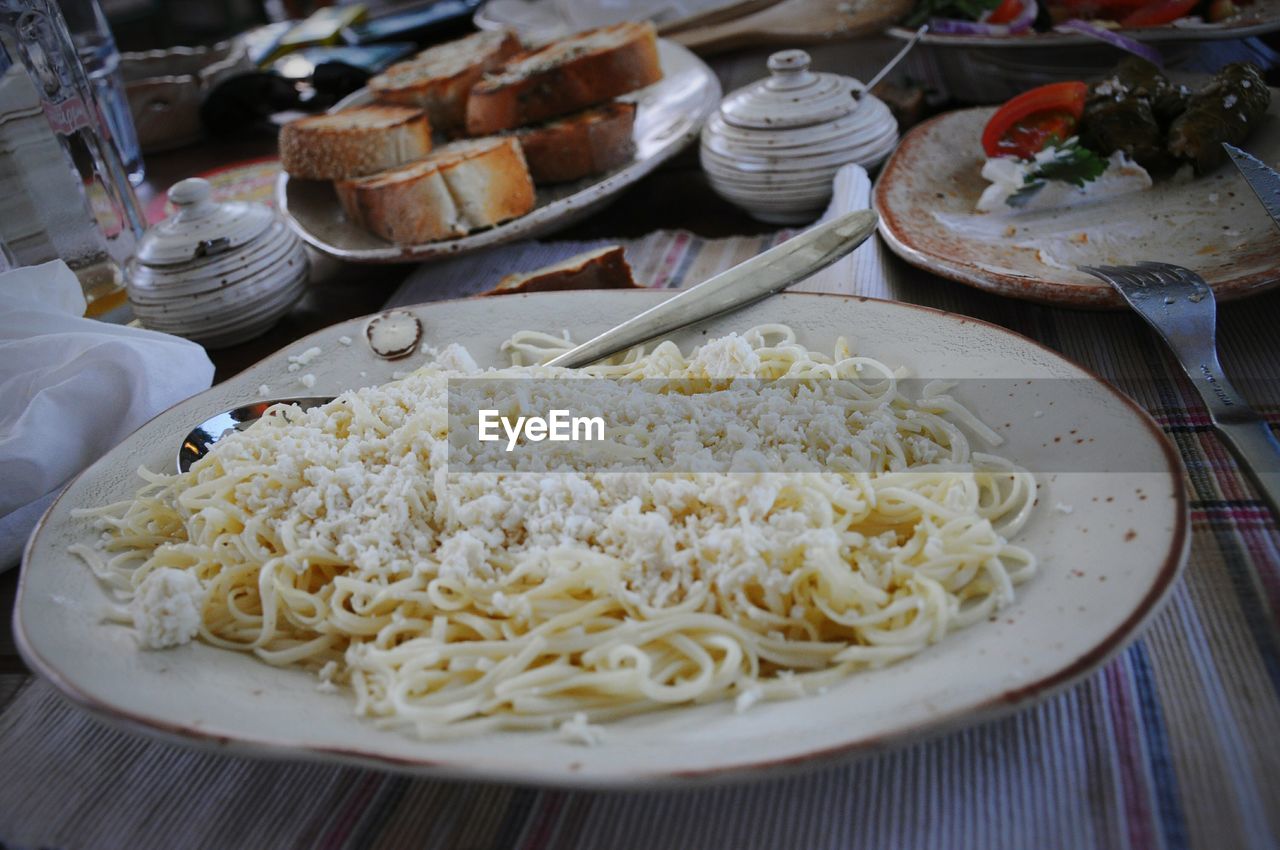 Close-up of pasta served in plate on dining table