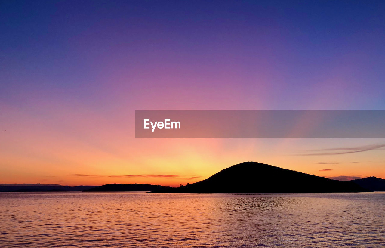 SCENIC VIEW OF SEA AGAINST ROMANTIC SKY