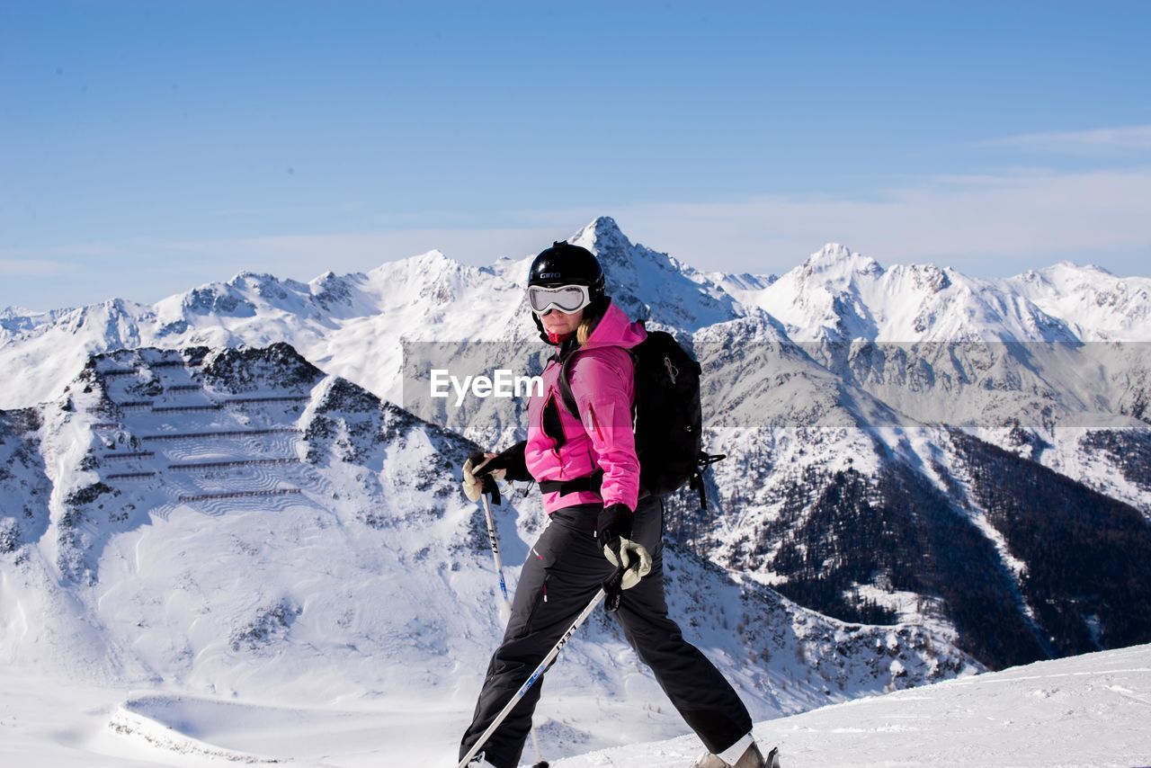 Full length of woman skiing on mountain
