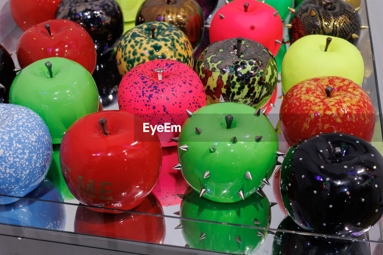 multi colored, large group of objects, no people, variation, toy, celebration, indoors, ball, still life, abundance, holiday, decoration, easter egg, food, red, close-up, arrangement, tradition, retail, for sale