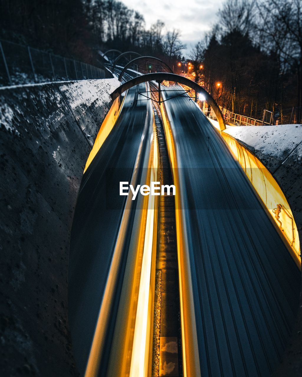 High angle view of light trails on road during winter