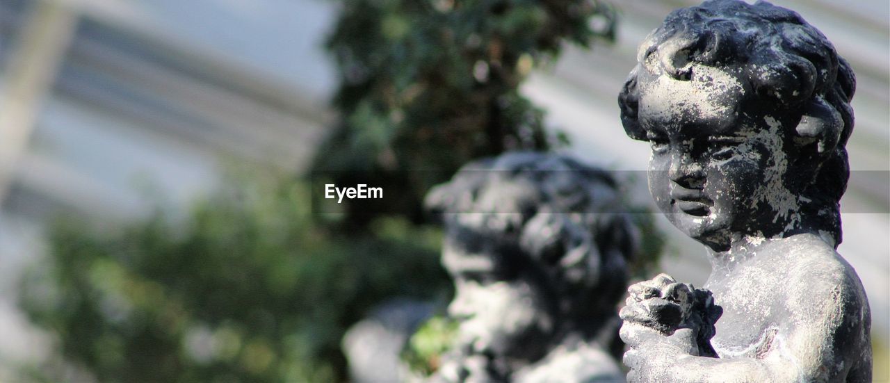 Close-up of statues at park