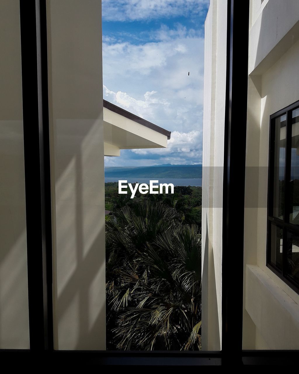SEA SEEN THROUGH GLASS WINDOW