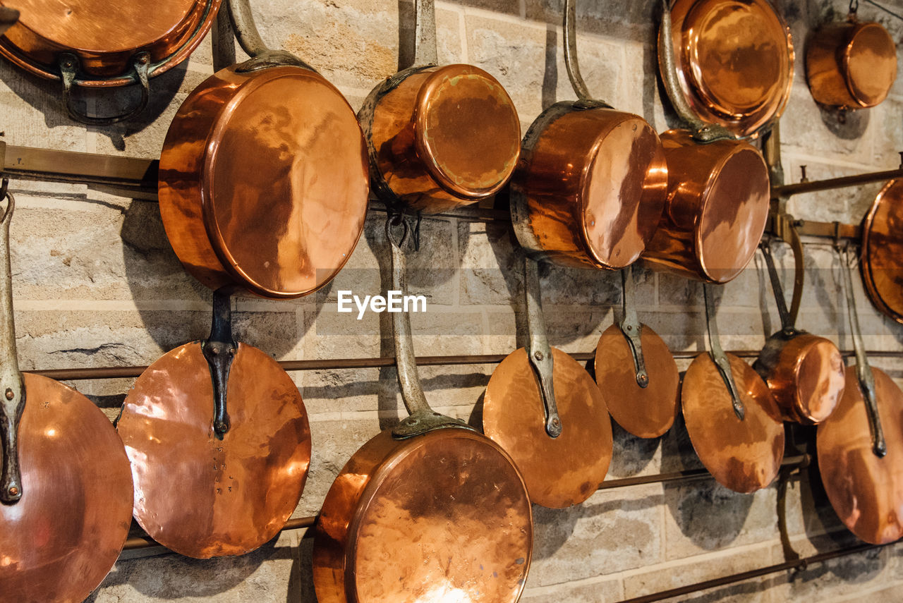 Utensils hanging on wooden wall for sale