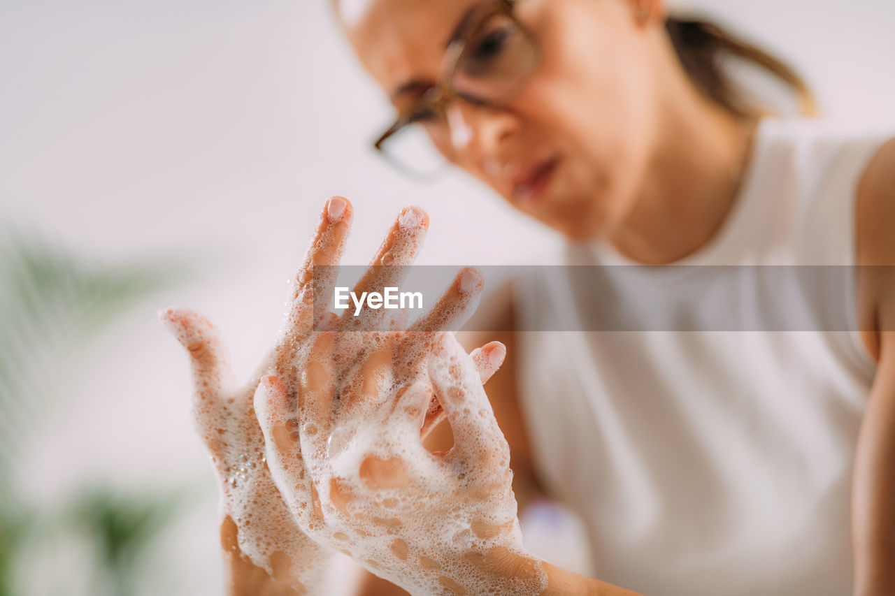 Obsessive compulsive disorder concept. woman obsessively washing her hands.