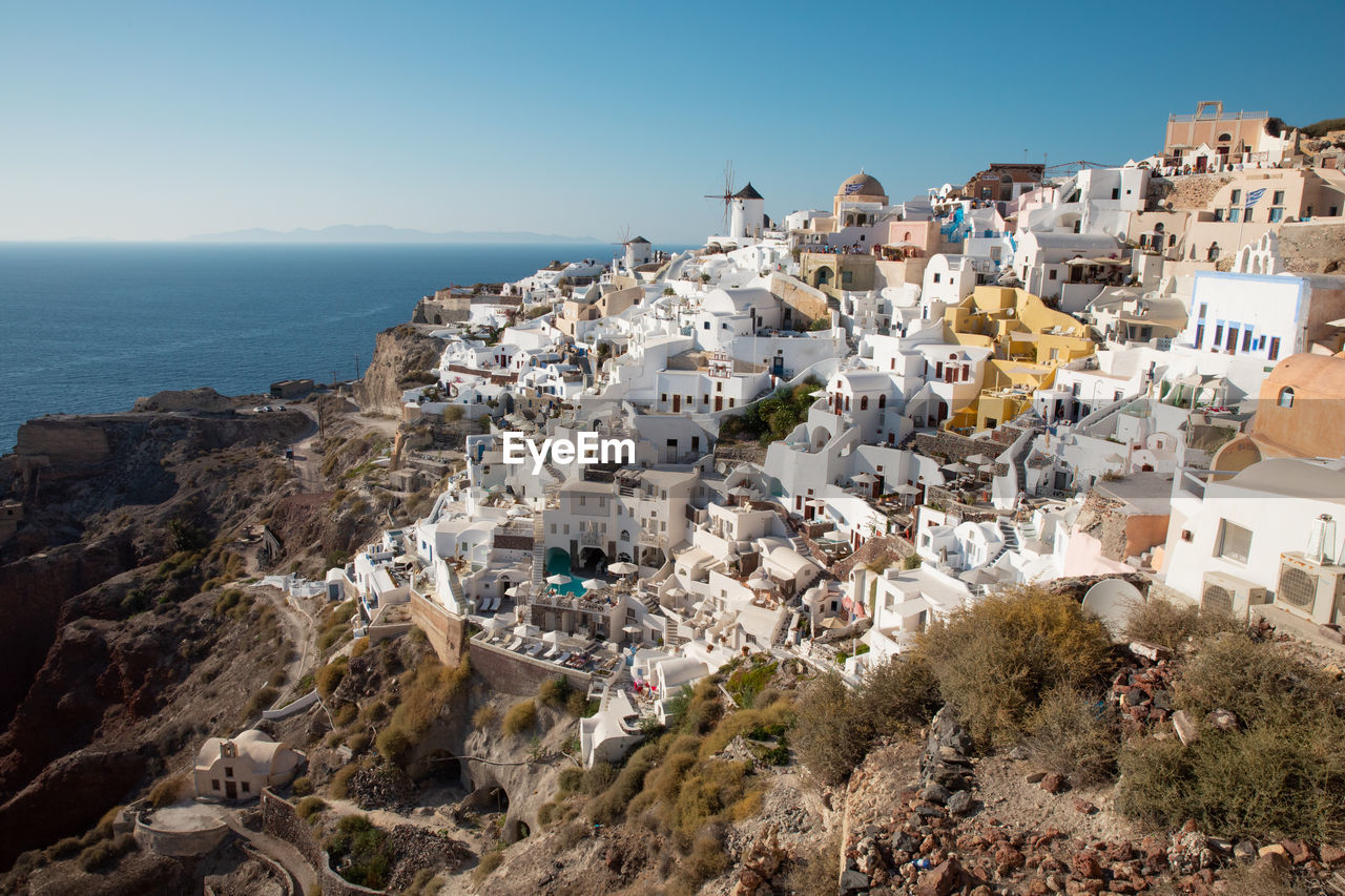 Aerial view of townscape by sea