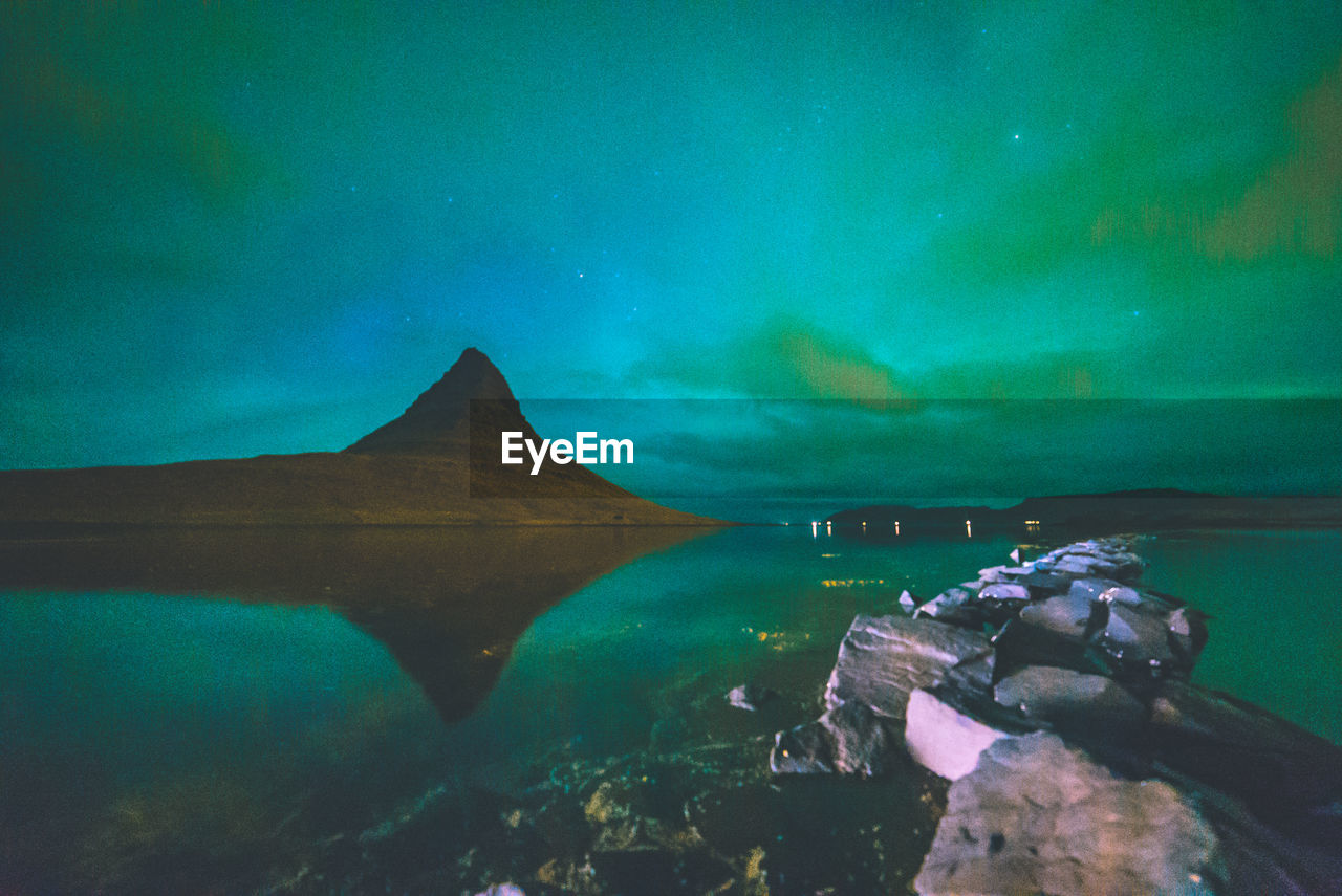 Scenic view of sea against sky at night