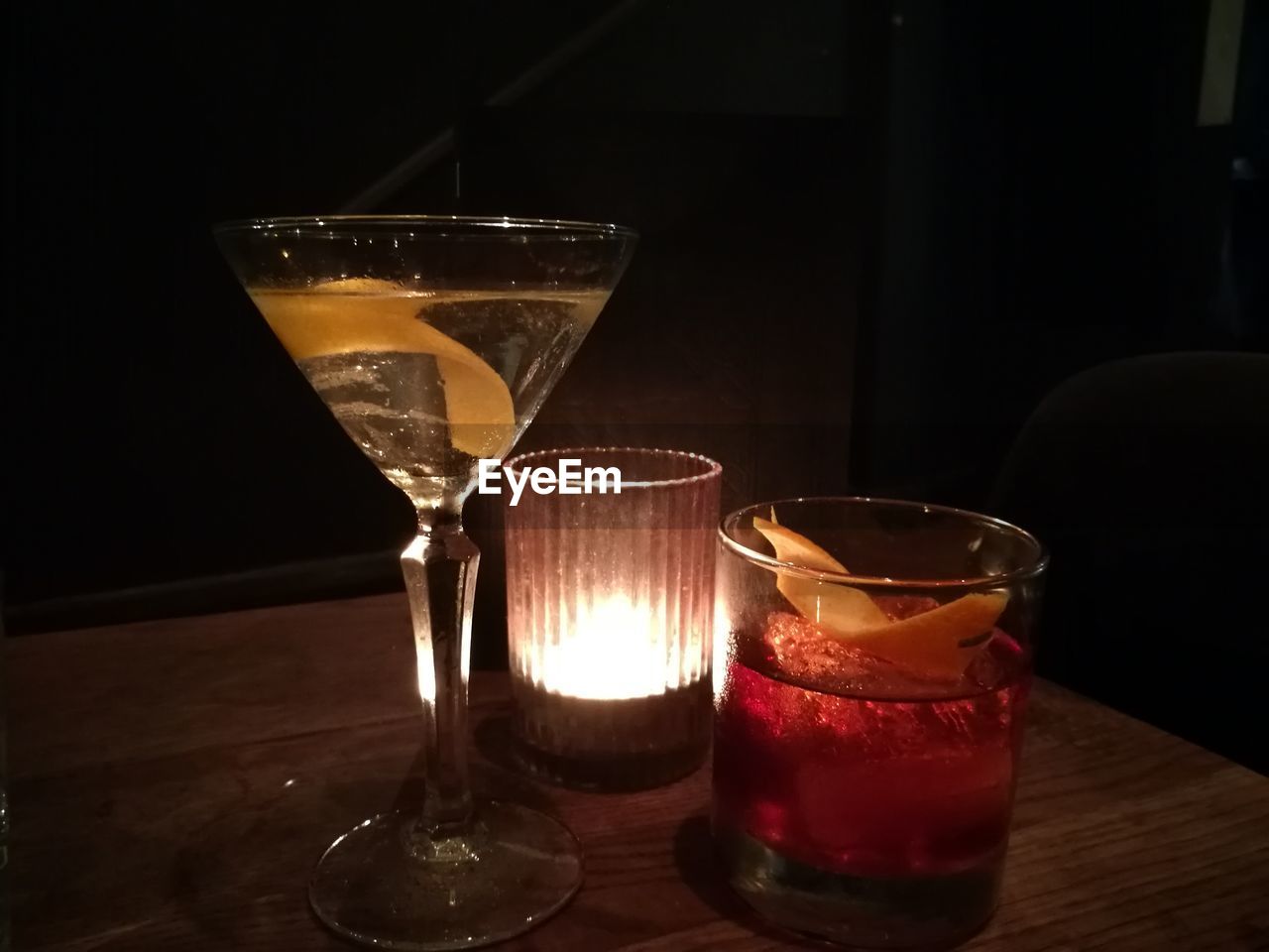 Close-up of drink in glasses on illuminated table