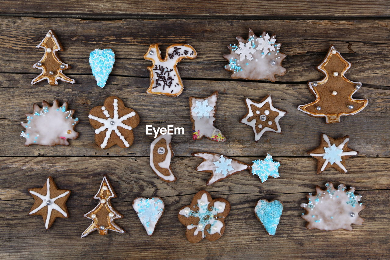 High angle view of christmas cookies on wooden table