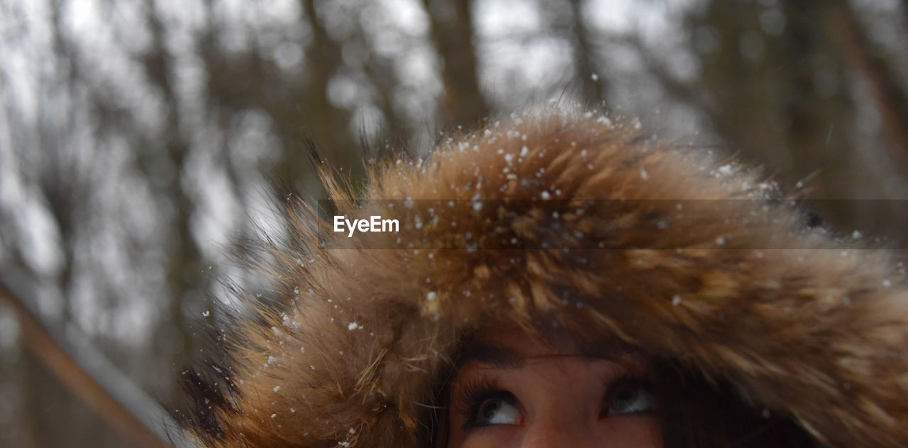 Close-up of young woman in snow