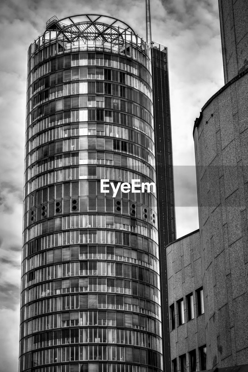 black and white, architecture, built structure, building exterior, monochrome, tower block, skyscraper, monochrome photography, urban area, city, building, black, sky, industry, tower, low angle view, office building exterior, no people, cloud, metropolis, white, landmark, business, office, nature, outdoors, construction industry, brutalist architecture, facade