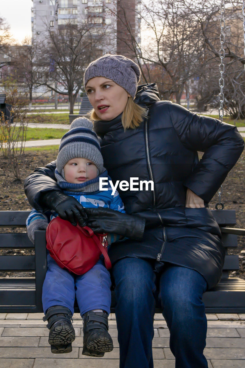 Portrait of father and son in winter