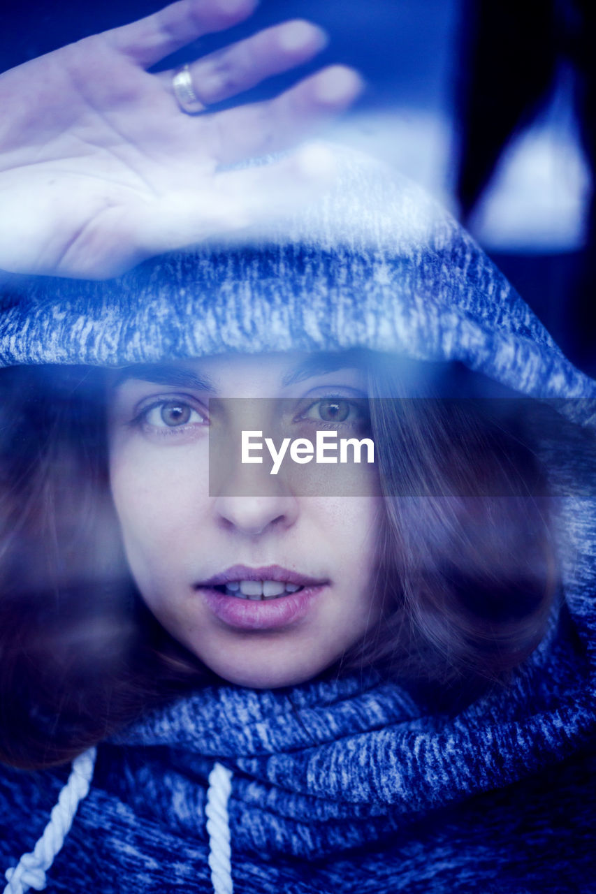 Close-up portrait of woman in winter