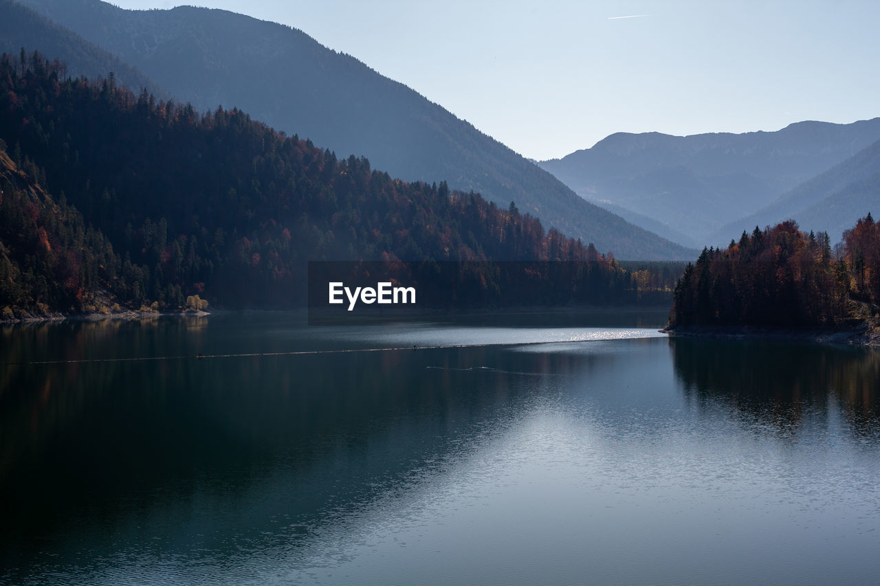 Scenic view of lake and mountains against sky