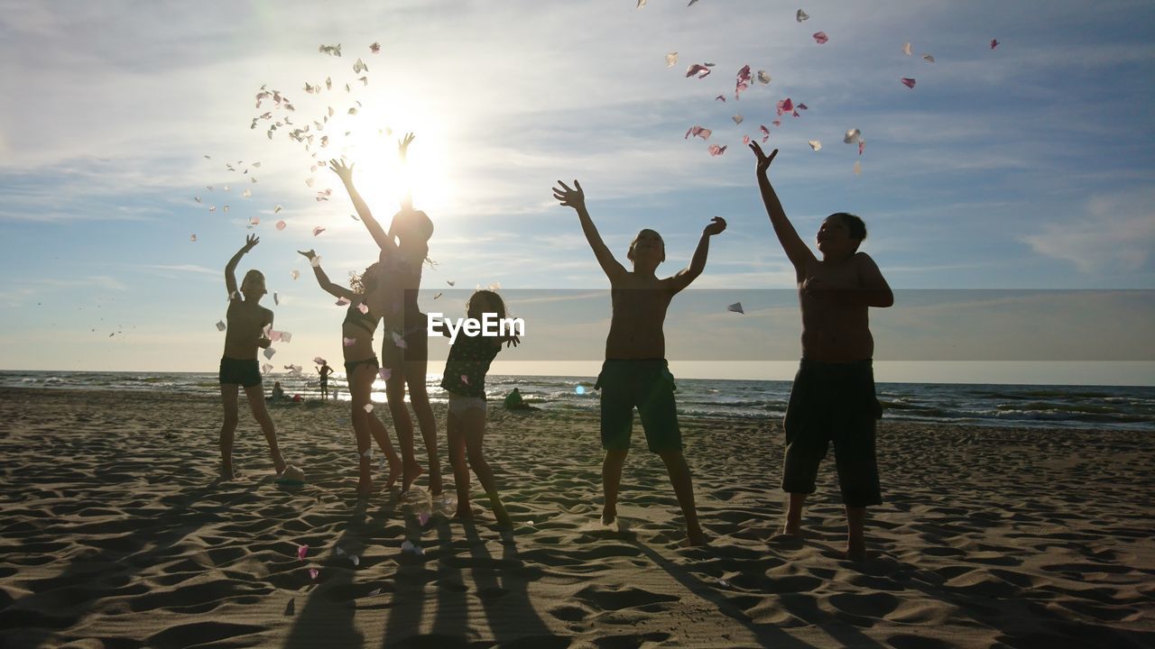 PEOPLE ENJOYING ON BEACH