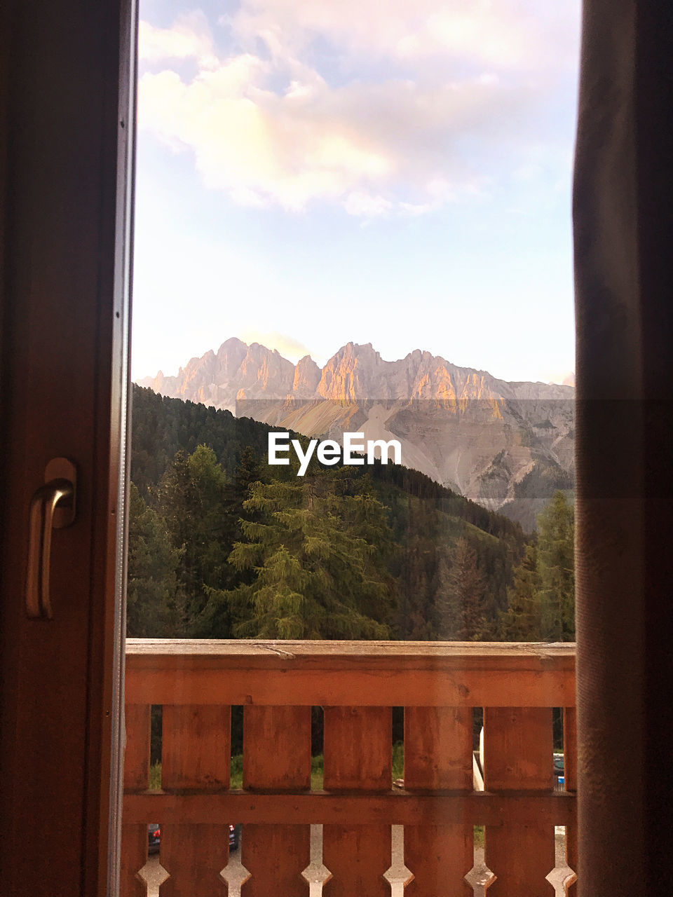 VIEW OF MOUNTAINS THROUGH WINDOW