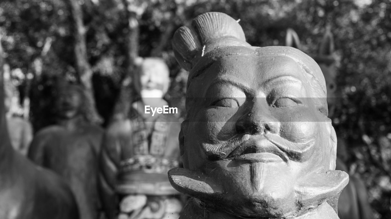 CLOSE-UP OF BUDDHA STATUE