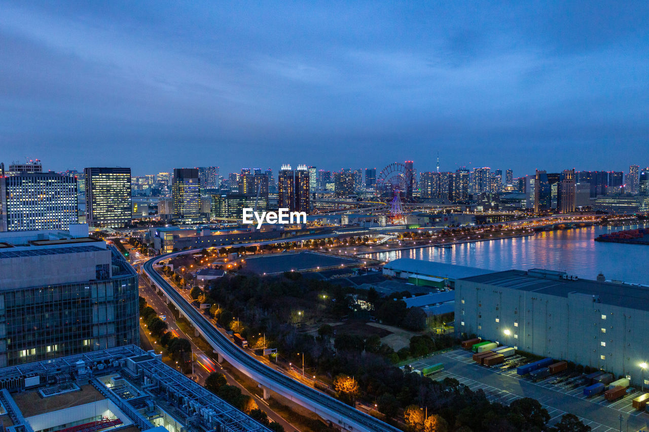 High angle view of illuminated city buildings at night