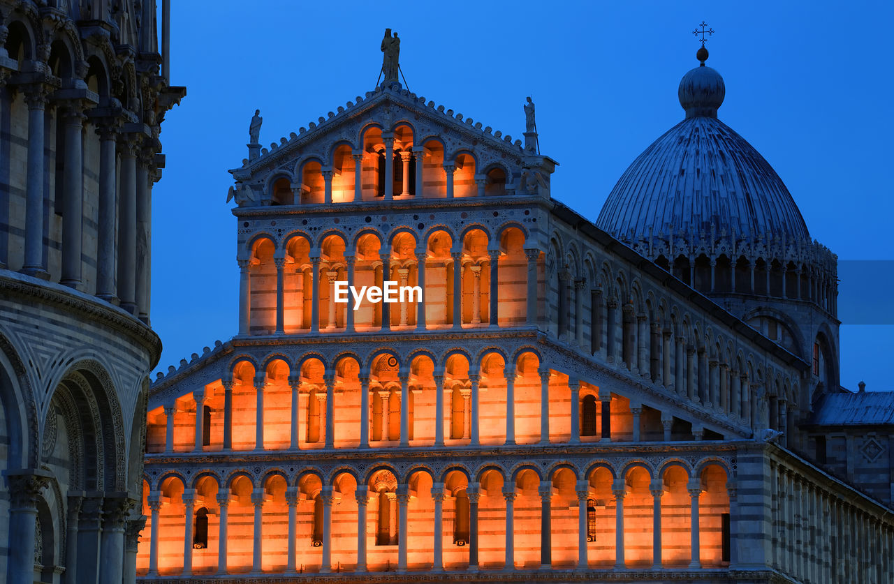 Low angle view of illuminated pisa cathedral against clear sky