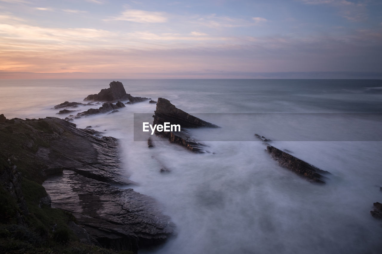 Scenic view of sea against sky during sunset