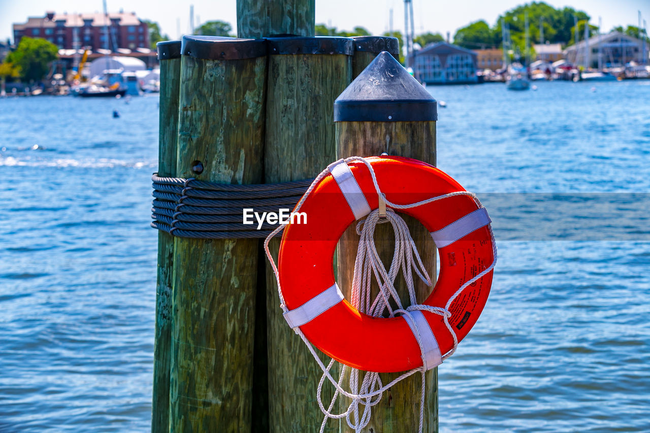 RED WOODEN POST IN SEA