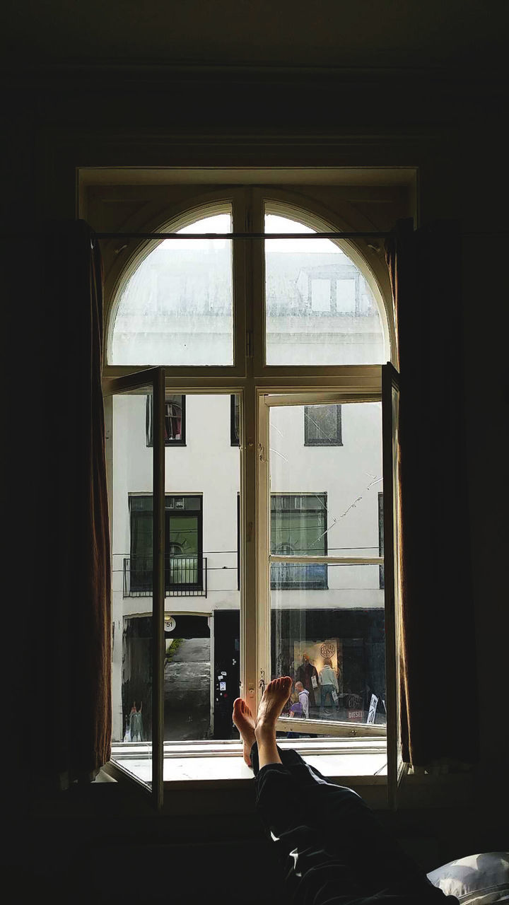 VIEW OF WOMAN WALKING ON WALL