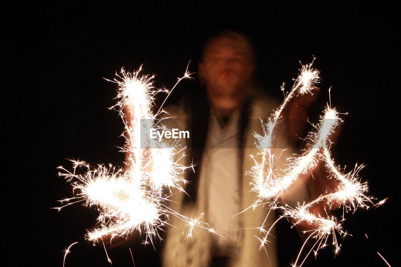 LOW ANGLE VIEW OF FIREWORK DISPLAY