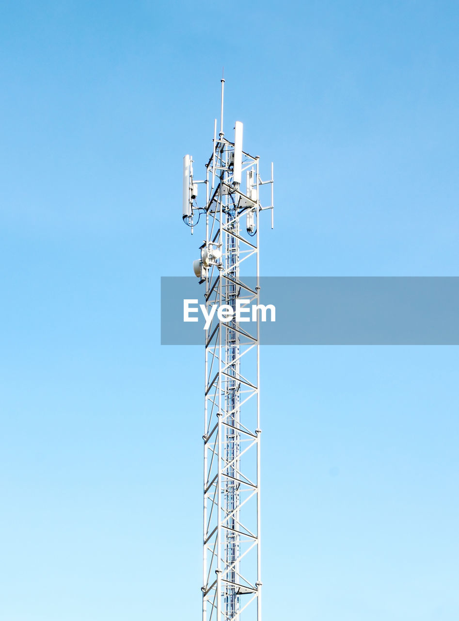 LOW ANGLE VIEW OF COMMUNICATIONS TOWER AGAINST SKY