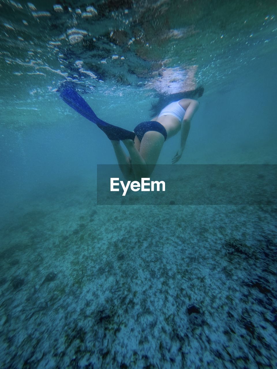 Woman swimming in sea