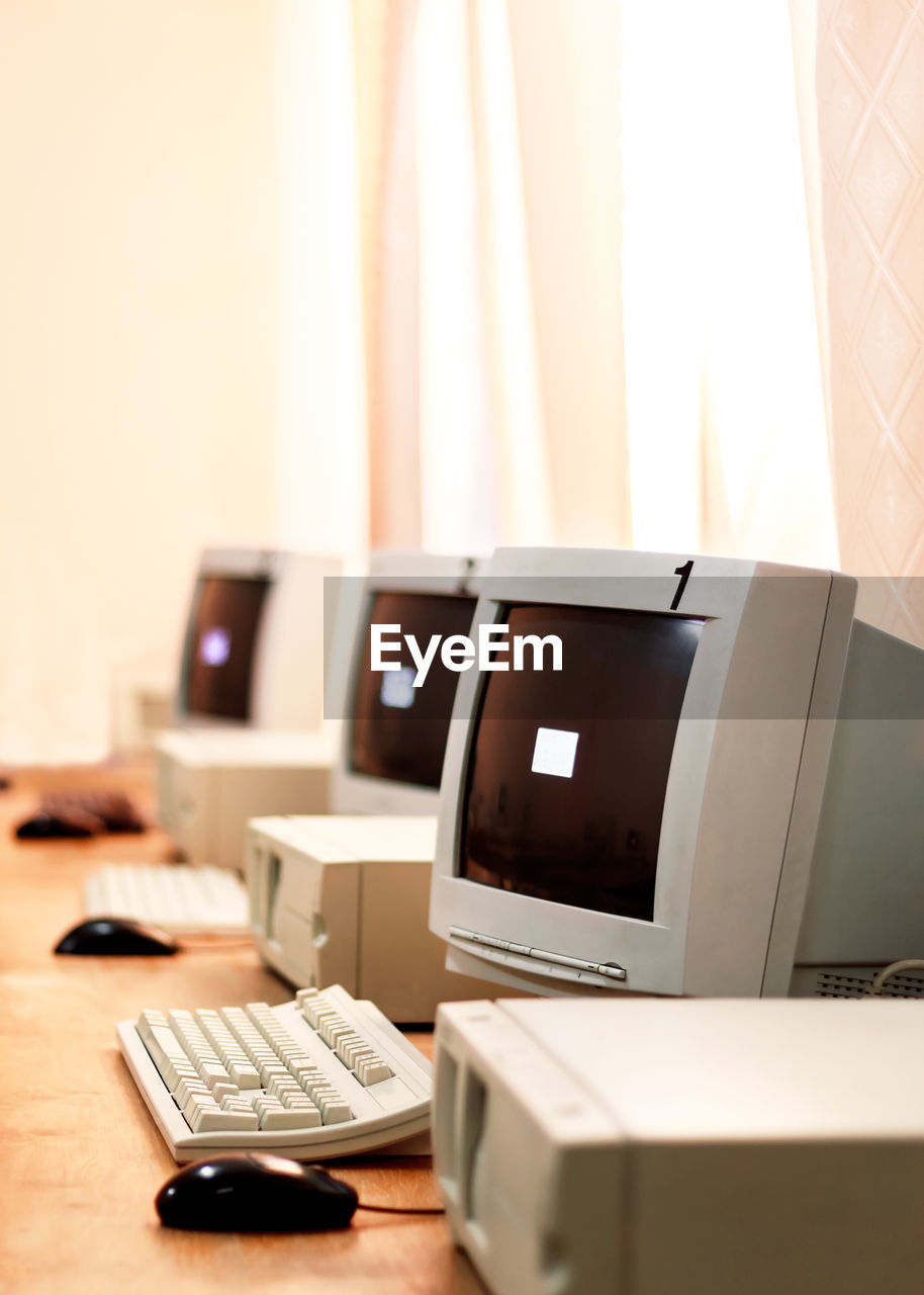 Several old computers in the computer room