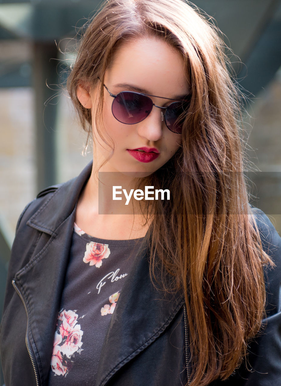 Close-up of beautiful woman wearing sunglasses